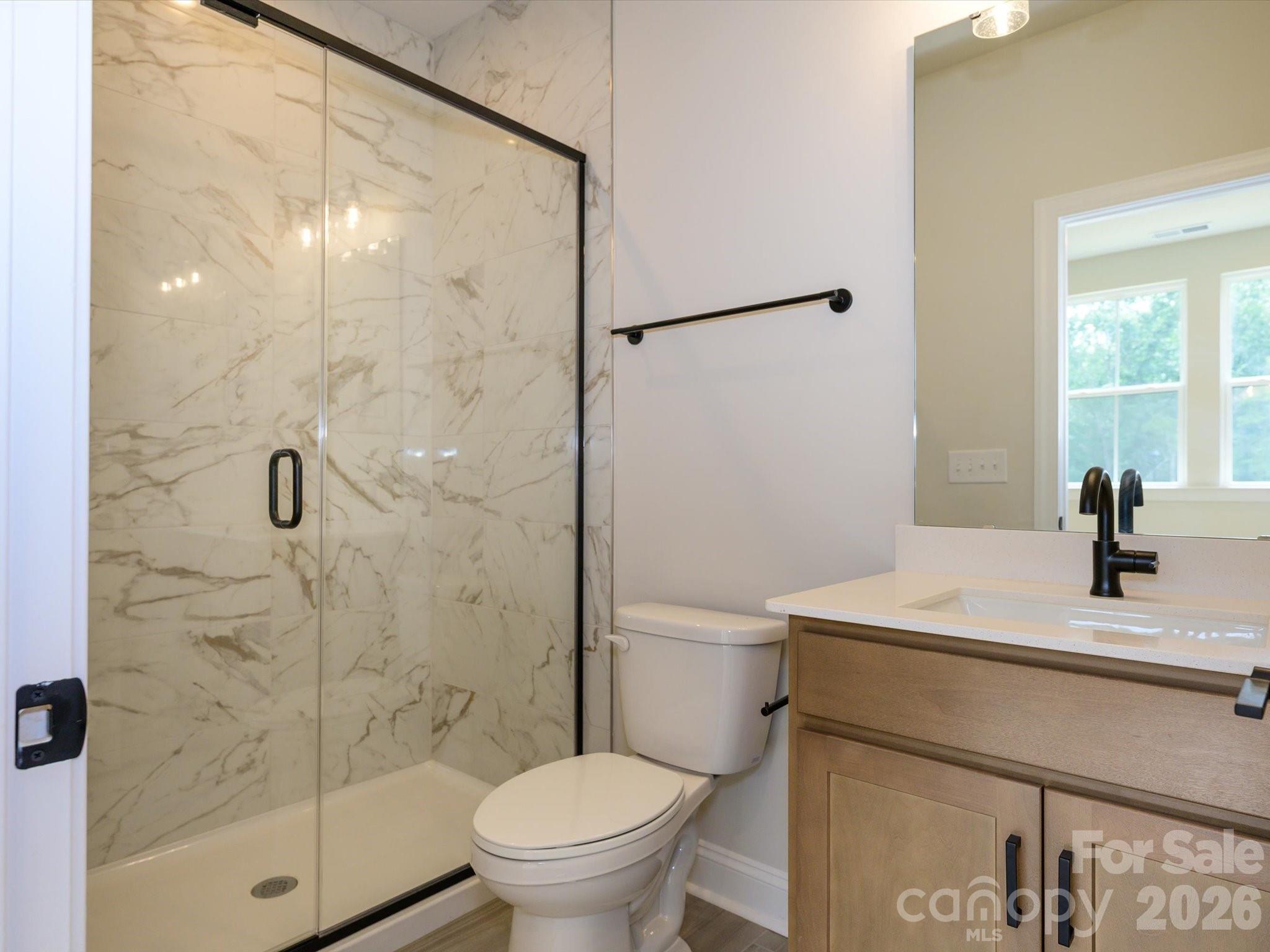 403 Old Town Vlg Road Waxhaw, NC 28173 - Photo 5 of 23 a bathroom with a sink toilet and shower