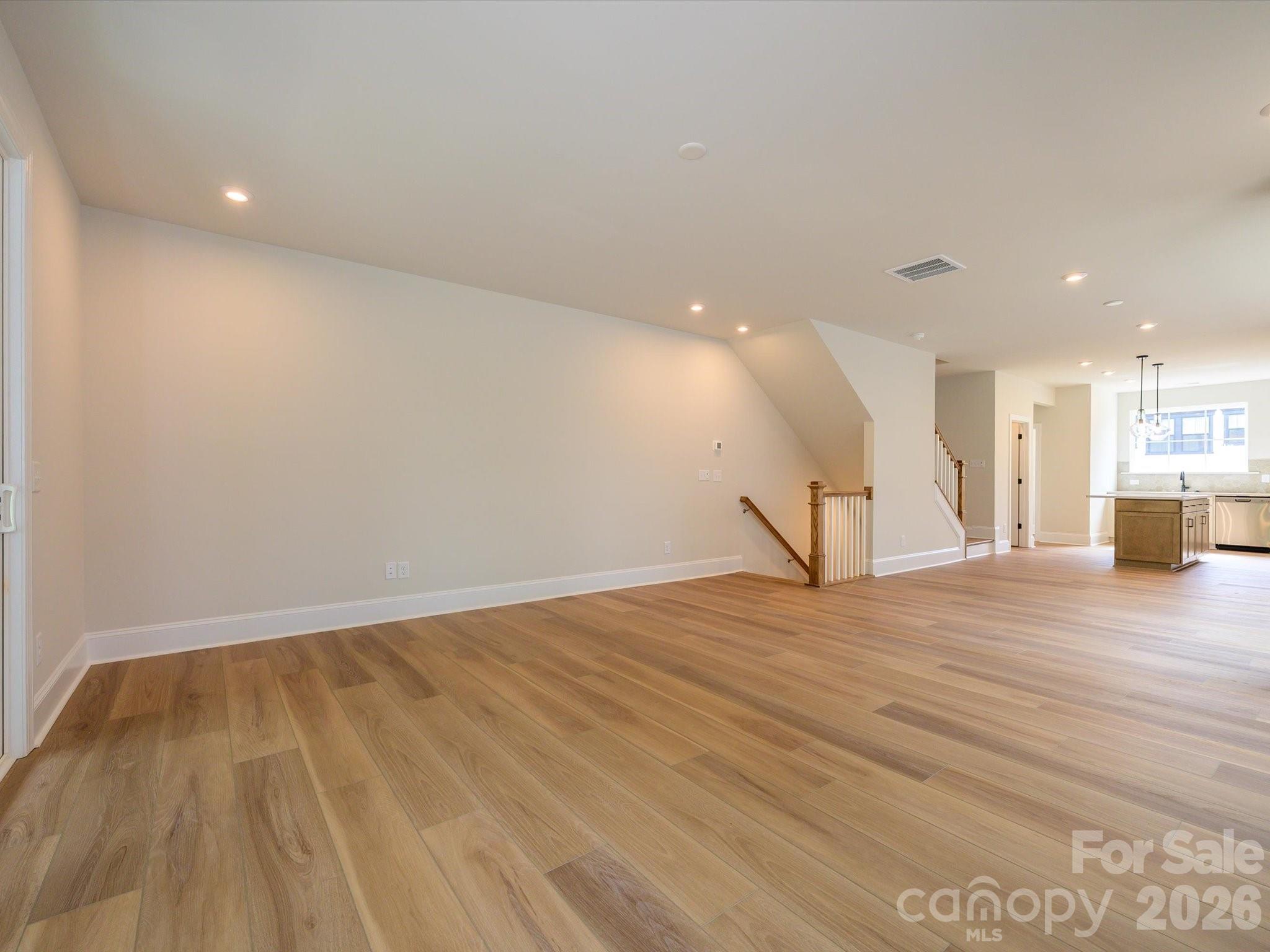 403 Old Town Vlg Road Waxhaw, NC 28173 - Photo 10 of 23 a view of empty room with wooden floor