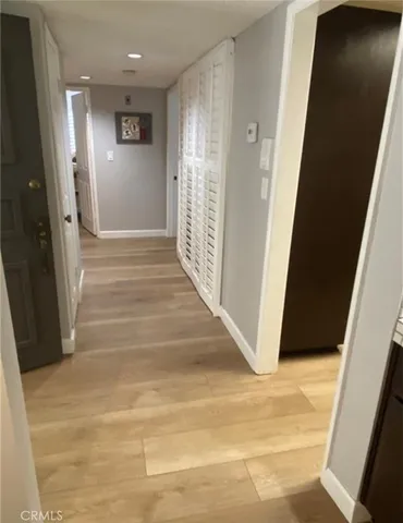 a bedroom with a bed and a night stand