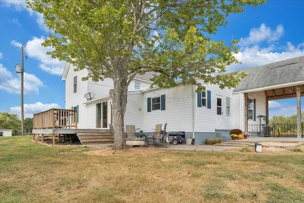 a view of a house with snow on the background