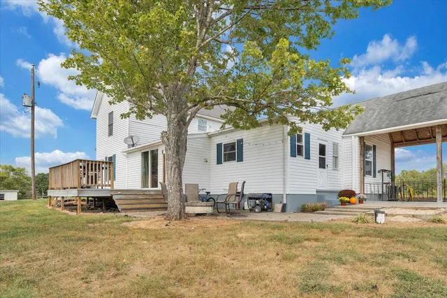 a view of a house with snow on the background