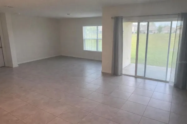 a view of an empty room and window
