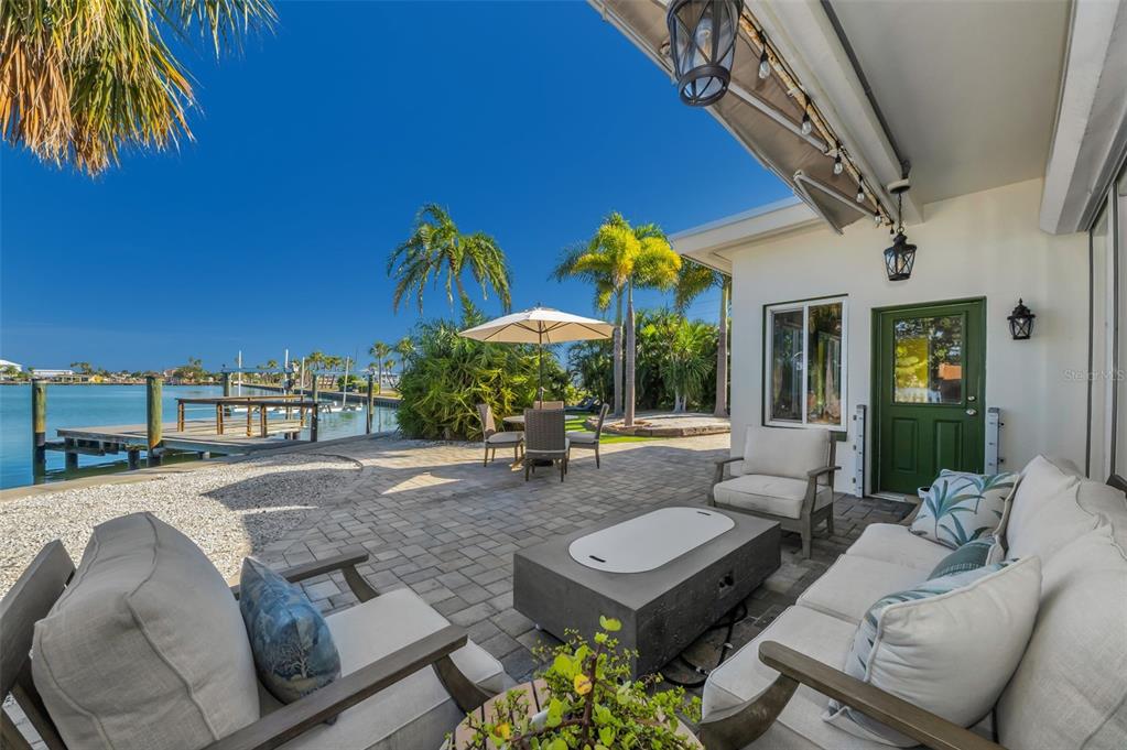 16101 Redington Drive Redington Beach, FL 33708 - Photo 12 of 43 a living room with furniture and a patio