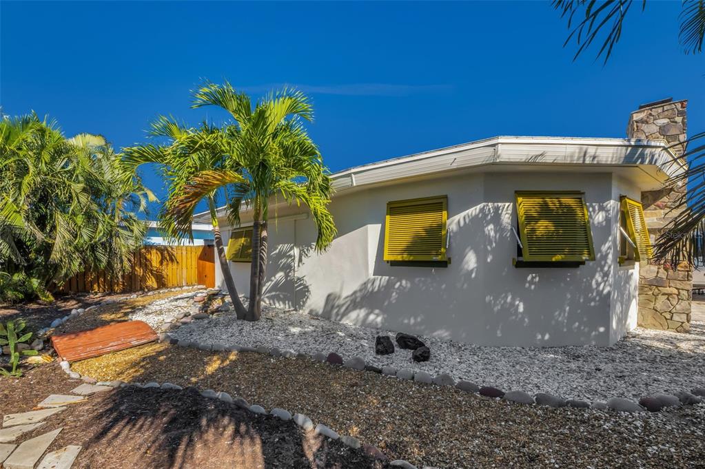 16101 Redington Drive Redington Beach, FL 33708 - Photo 18 of 43 a front view of a house with garden