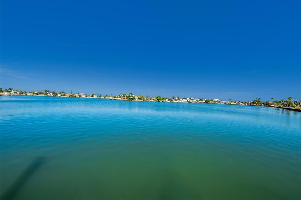 16101 Redington Drive Redington Beach, FL 33708 - Photo 3 of 43 a view of a lake and houses with outdoor space