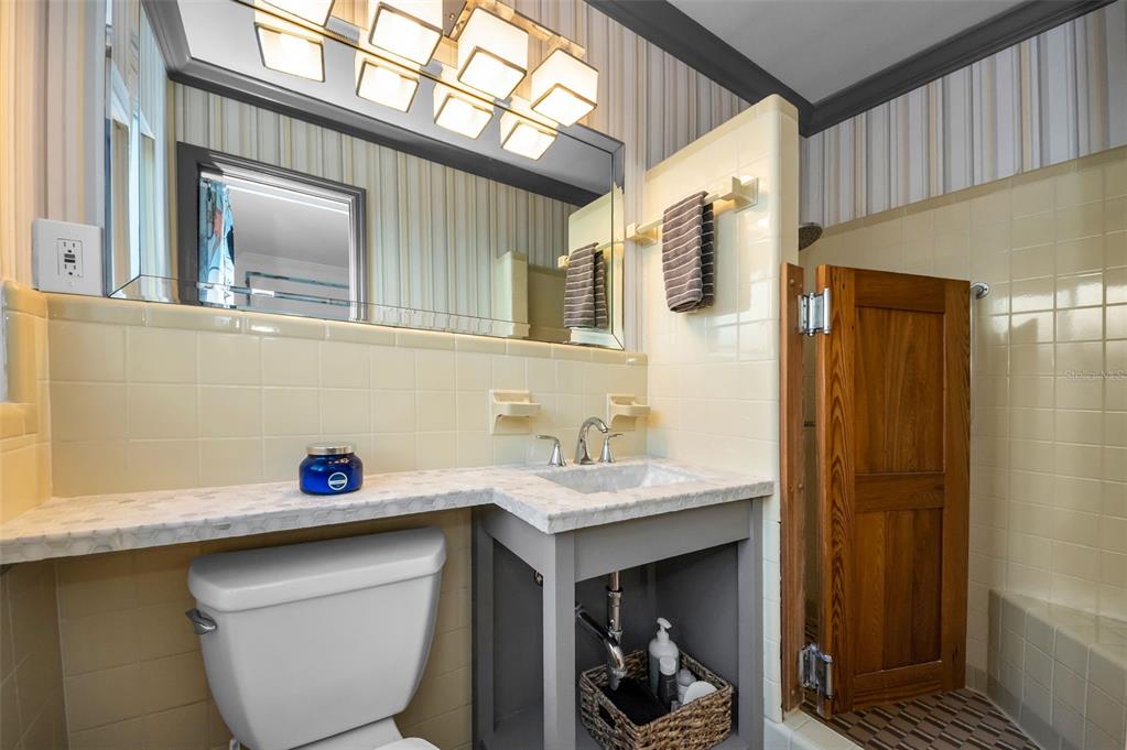 16101 Redington Drive Redington Beach, FL 33708 - Photo 32 of 43 a bathroom with a sink and a mirror