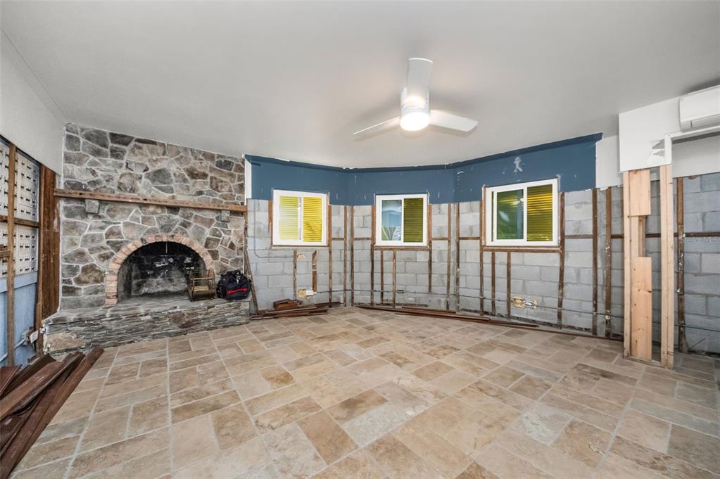 16101 Redington Drive Redington Beach, FL 33708 - Photo 34 of 43 a view of empty room with a fireplace