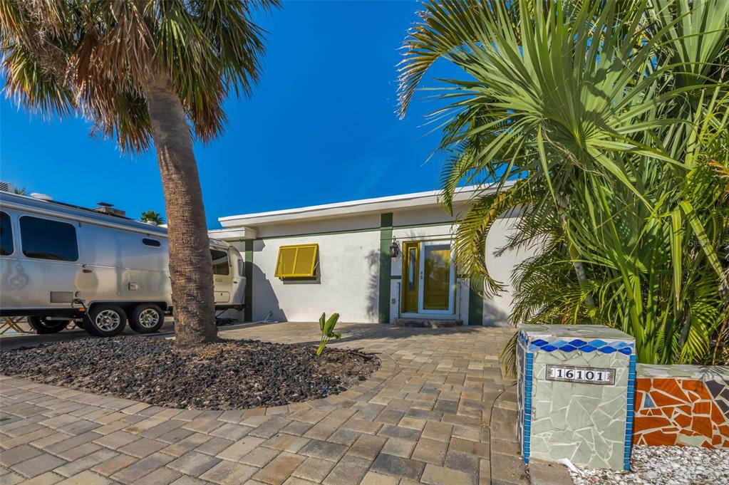 16101 Redington Drive Redington Beach, FL 33708 - Photo 40 of 43 a front view of a house with garden