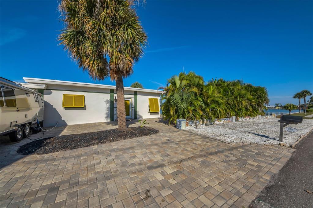 16101 Redington Drive Redington Beach, FL 33708 - Photo 41 of 43 a front view of a house with garden