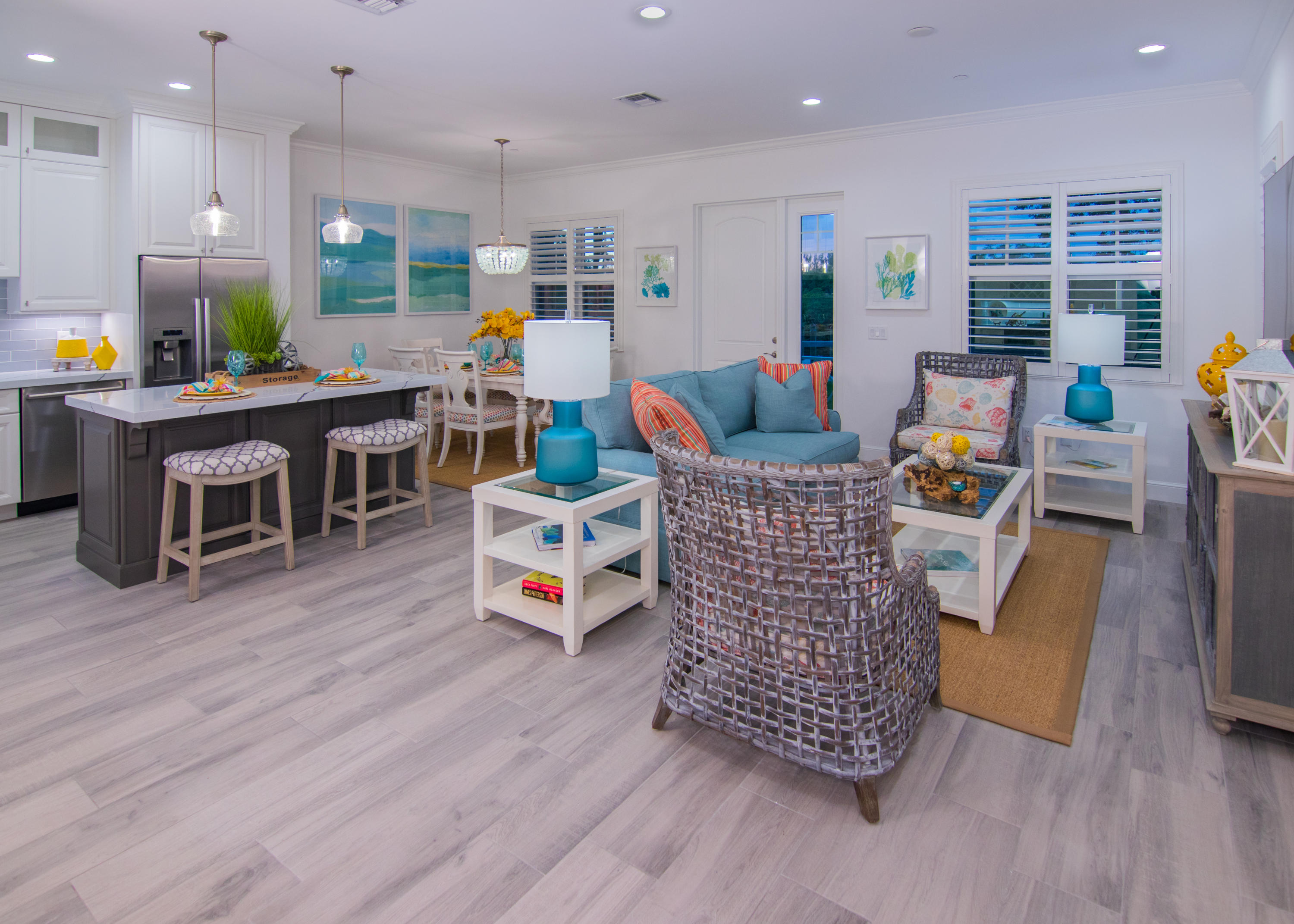 an outdoor living room with furniture and wooden floor