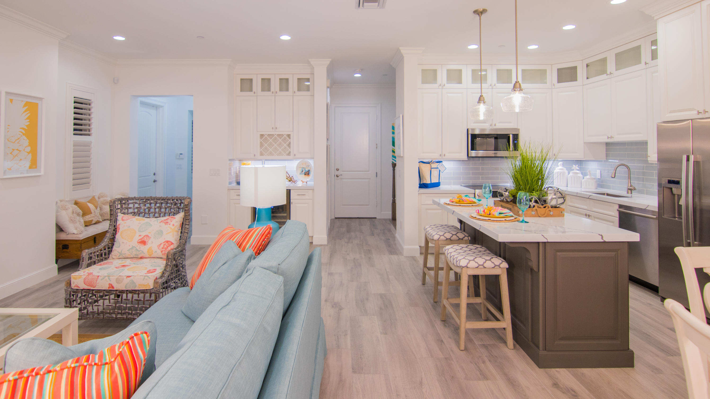203 Inlet Waters Circle Jupiter, FL 33477 - Photo 3 of 12 a dining room with stainless steel appliances kitchen island granite countertop furniture a rug kitchen view and a chandelier