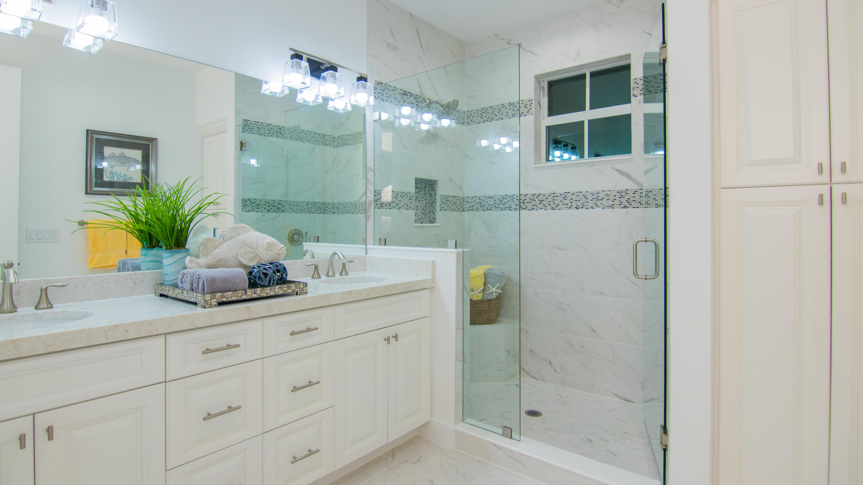 203 Inlet Waters Circle Jupiter, FL 33477 - Photo 7 of 12 a bathroom with a granite countertop sink a mirror and a shower
