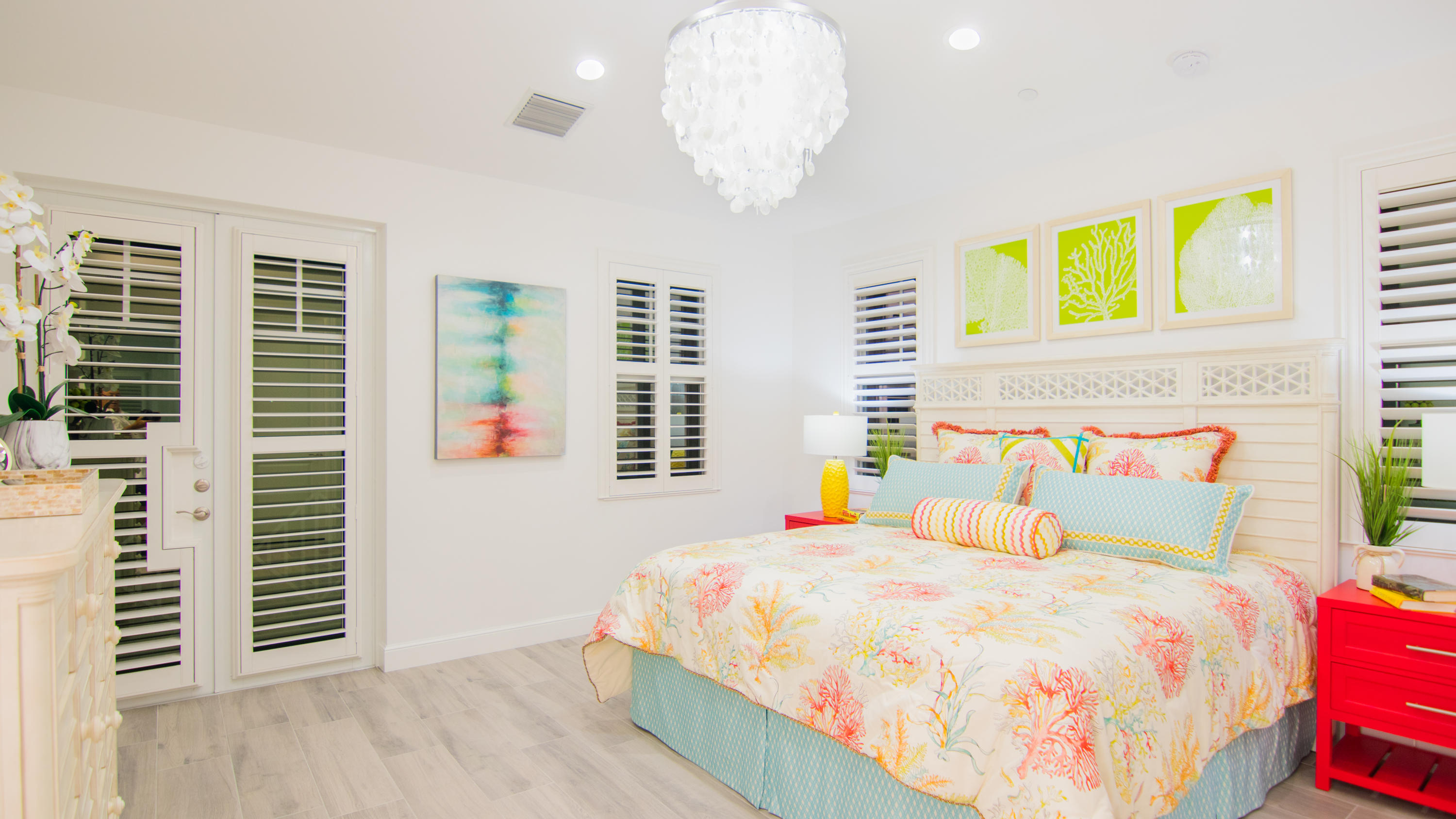 203 Inlet Waters Circle Jupiter, FL 33477 - Photo 8 of 12 a large bed sitting in a bedroom next to a window