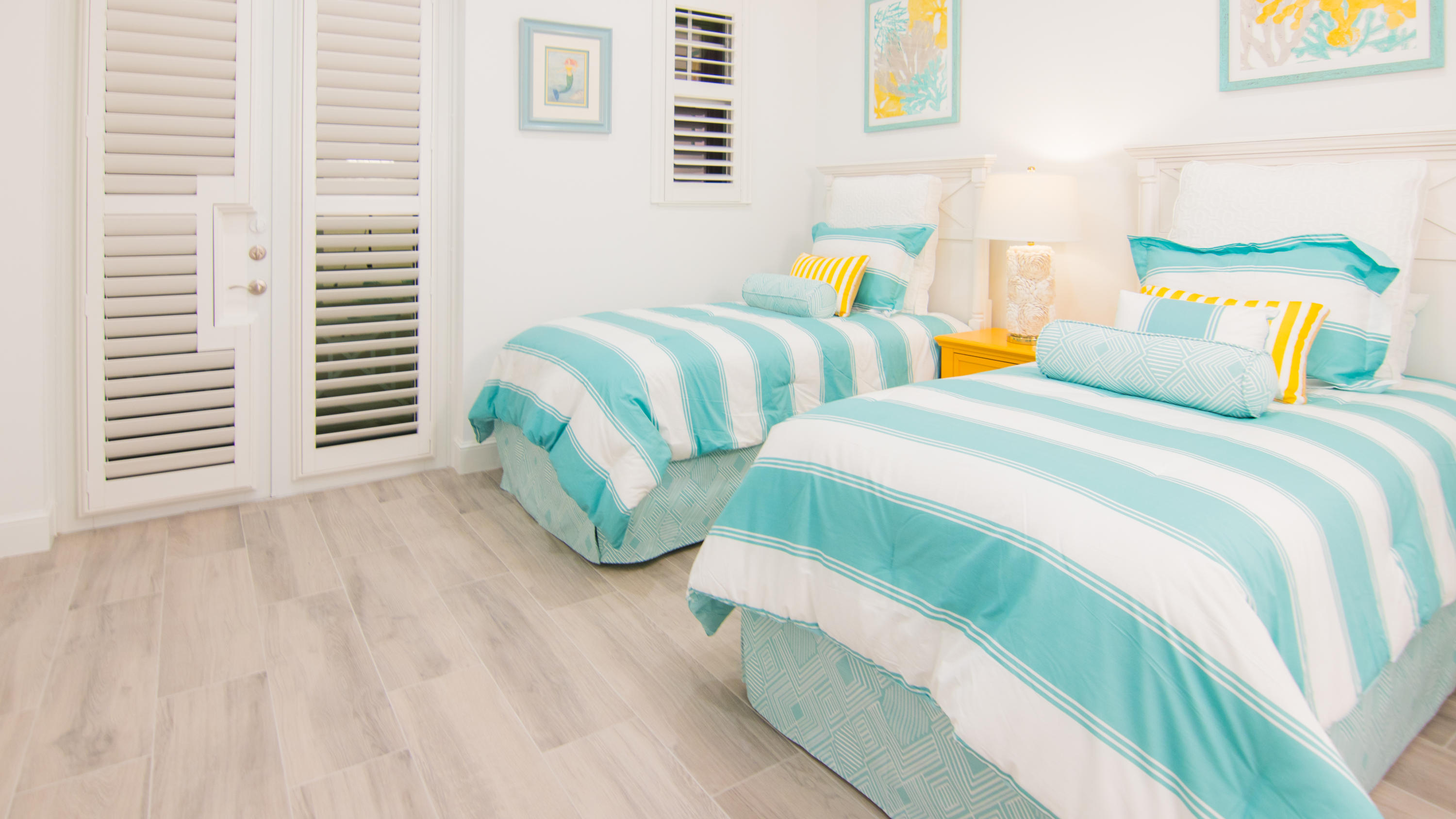 203 Inlet Waters Circle Jupiter, FL 33477 - Photo 10 of 12 a bedroom with two beds and a wooden floor