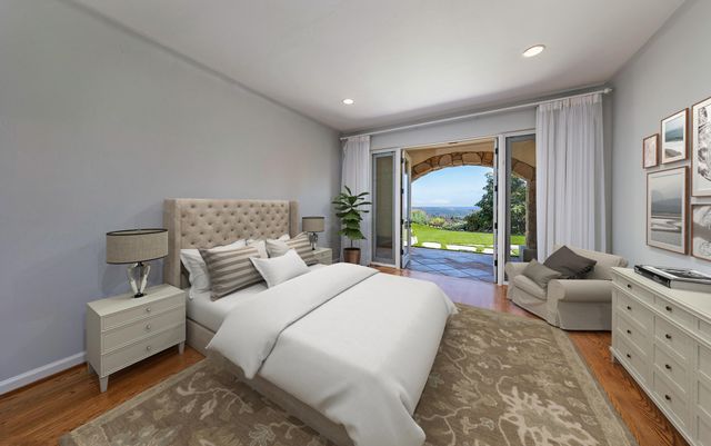 a bed room with bed and a large window