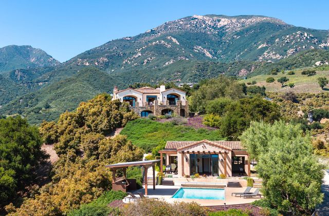 an aerial view of a house with a garden