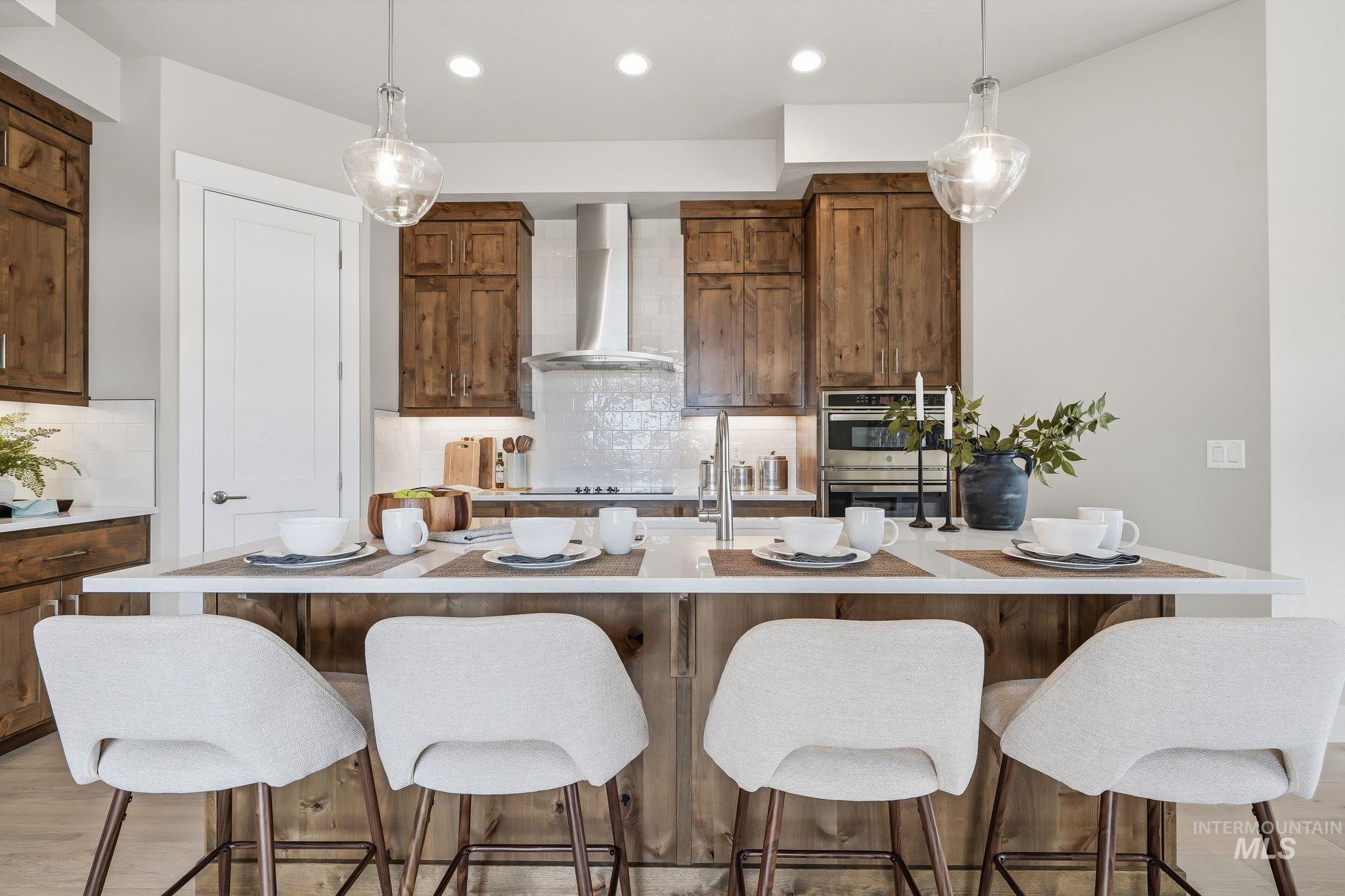 470 South Radiator Way Boise, ID 83716 - Photo 20 of 50 Spacious kitchen island featuring a light-toned countertop and wood-finish paneling