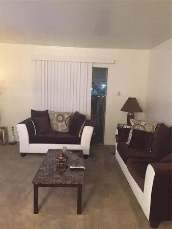a living room with furniture and a couch