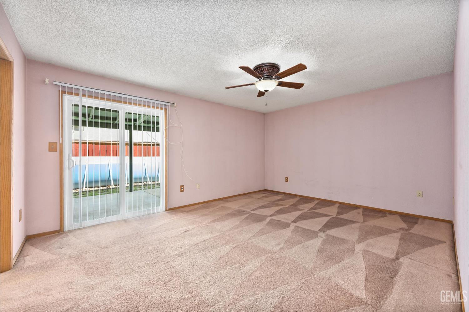 Undisclosed Address Bakersfield, CA 93307 - Photo 11 of 26 a view of an empty room with a window