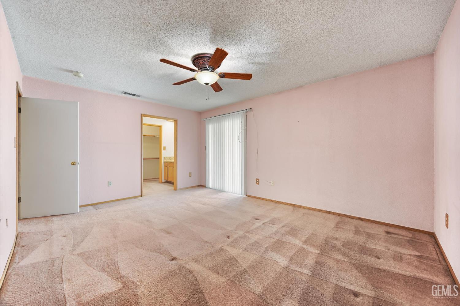 Undisclosed Address Bakersfield, CA 93307 - Photo 12 of 26 a view of an empty room with a window