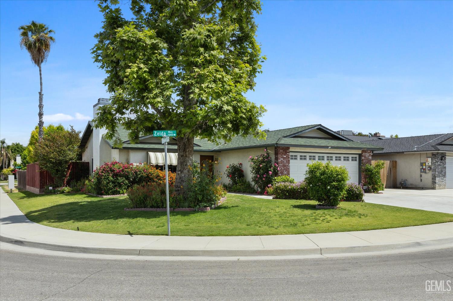 Undisclosed Address Bakersfield, CA 93307 - Photo 2 of 26 a view of front of house with a yard