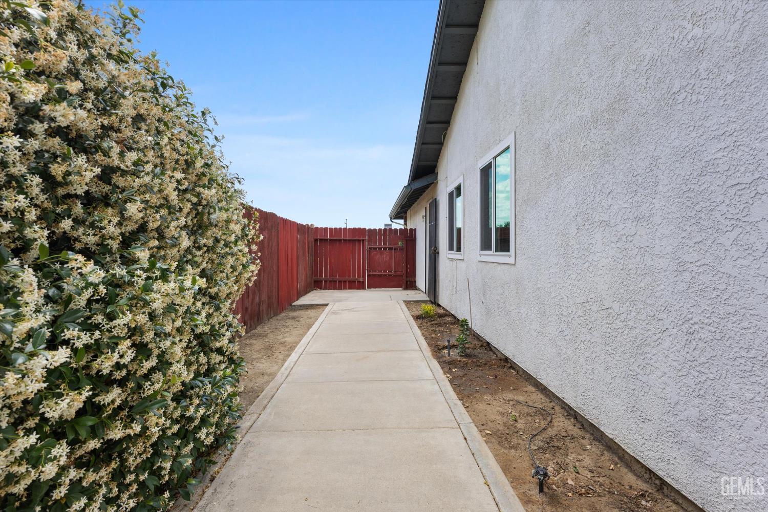 Undisclosed Address Bakersfield, CA 93307 - Photo 26 of 26 view of a pathway both side of the house