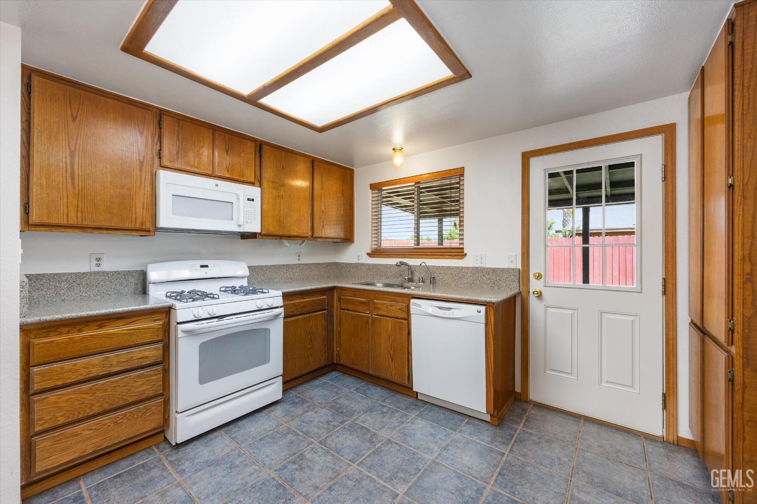 Undisclosed Address Bakersfield, CA 93307 - Photo 9 of 26 a kitchen with stainless steel appliances granite countertop a stove and a sink