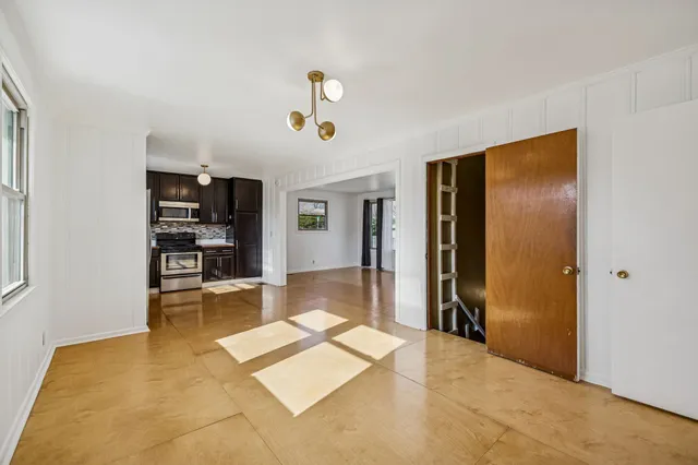 a view of a livingroom with furniture and windows