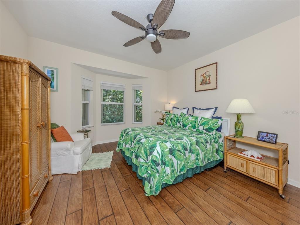 205 Reclinata Circle Venice, FL 34292 - Photo 24 of 62 a living room with furniture and a wooden floor