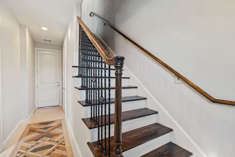 a view of entryway with wooden floor