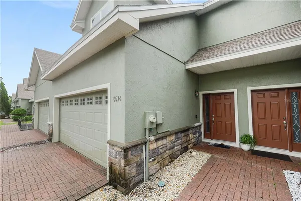 a view of a house with wooden deck