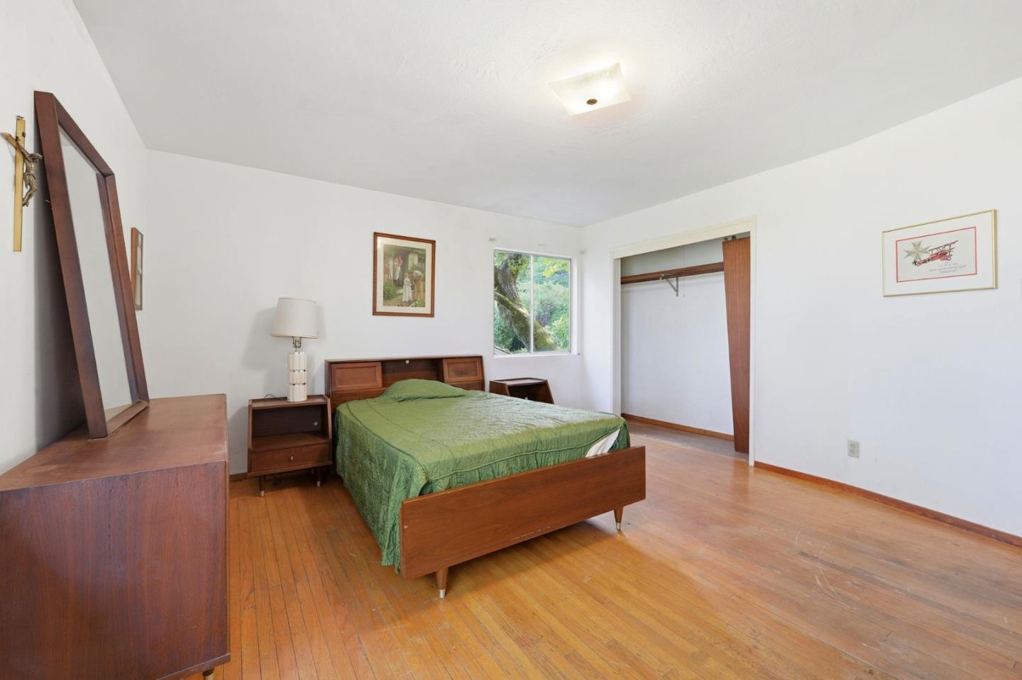 3915 Kingridge Drive San Mateo, CA 94403 - Photo 30 of 47 a bedroom with a bed and a flat screen tv