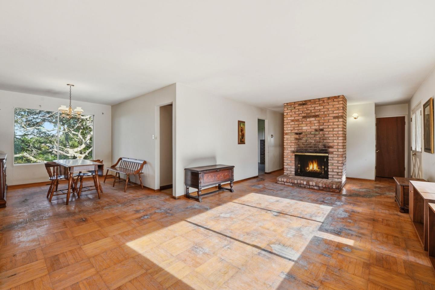 3915 Kingridge Drive San Mateo, CA 94403 - Photo 8 of 47 a living room with furniture a fireplace and a table