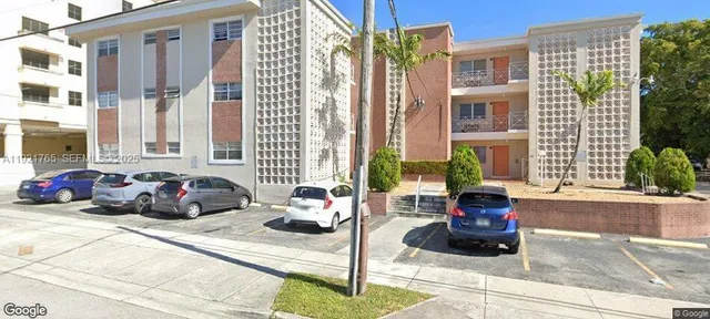 a view of a car park in front of a building