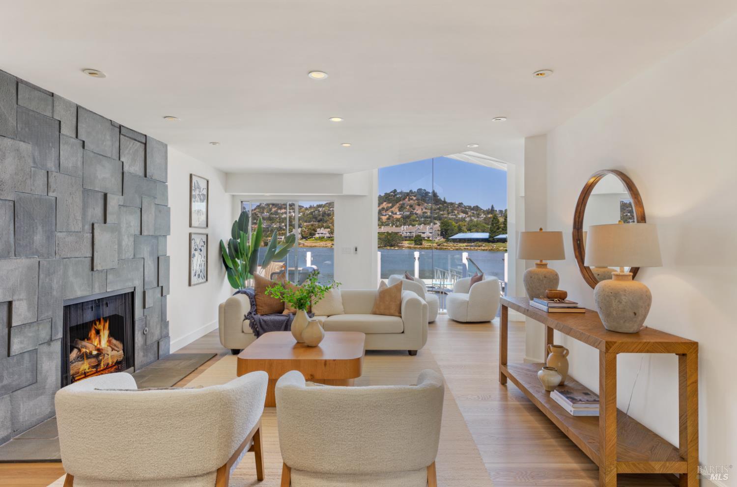 a living room with fireplace furniture and a fireplace