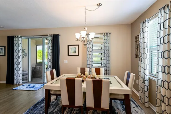 a view of a dining room with furniture and window
