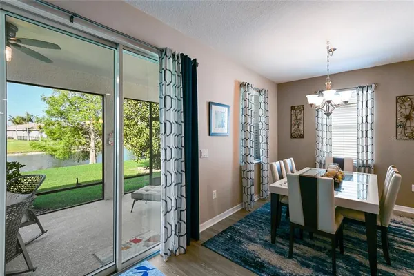 a view of a dining room with furniture window and outside view