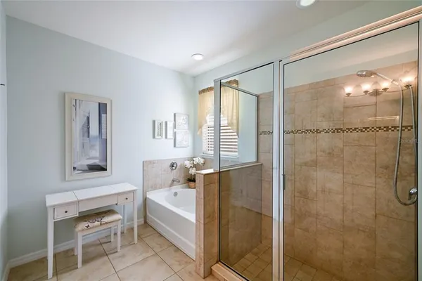 a bathroom with a bathtub and shower