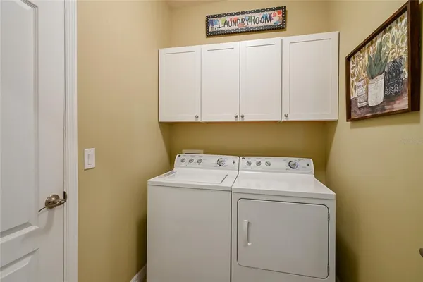 a utility room with dryer and washer