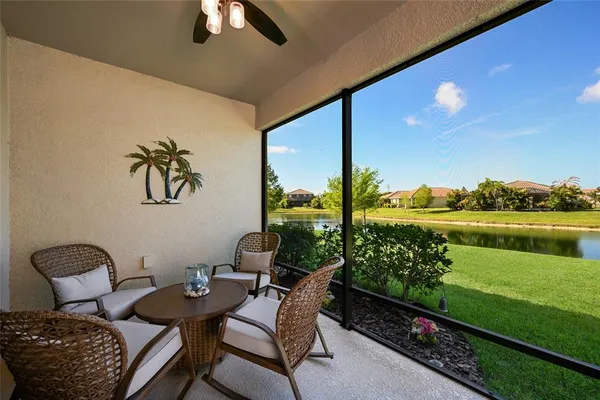 a balcony with chairs and a table
