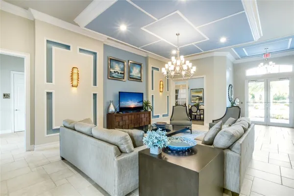 a large dining area with stainless steel appliances lots of counter space and furniture