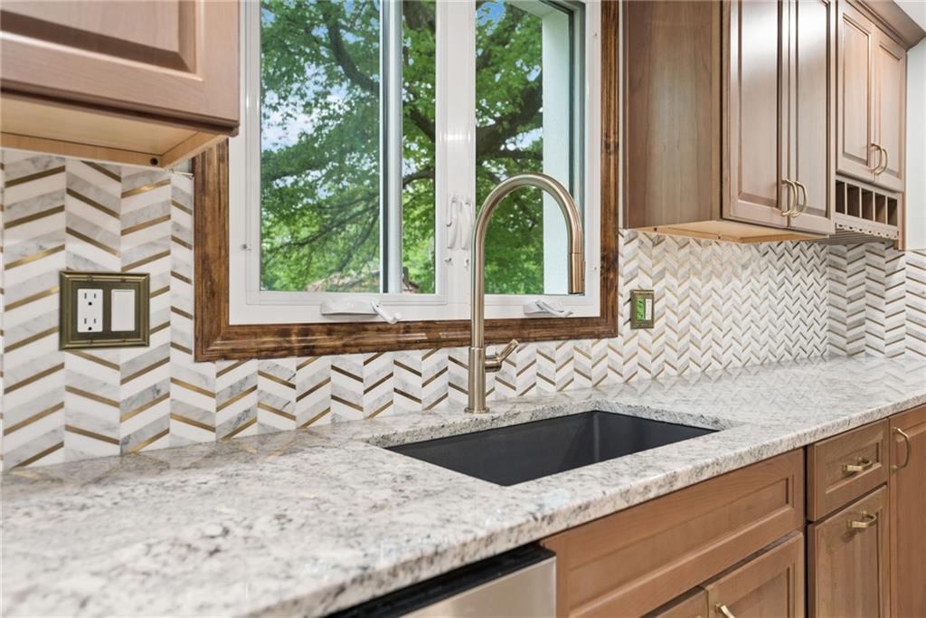 22 Buzzardtown Road Irwin, PA 15642 - Photo 9 of 44 a view of a sink a microwave and a window