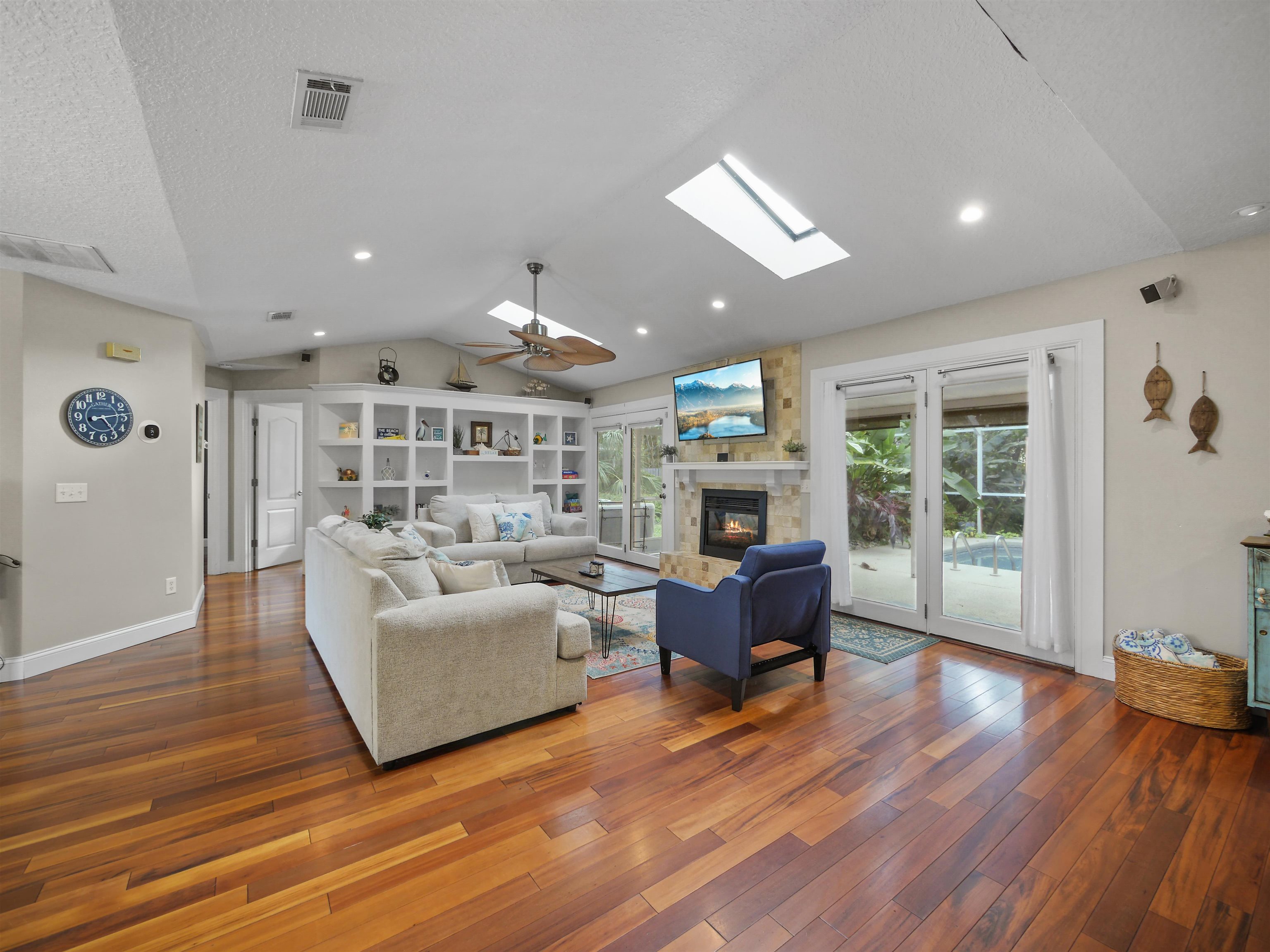 5301 1st Street St. Augustine, FL 32080 - Photo 12 of 36 a living room with furniture and a wooden floor