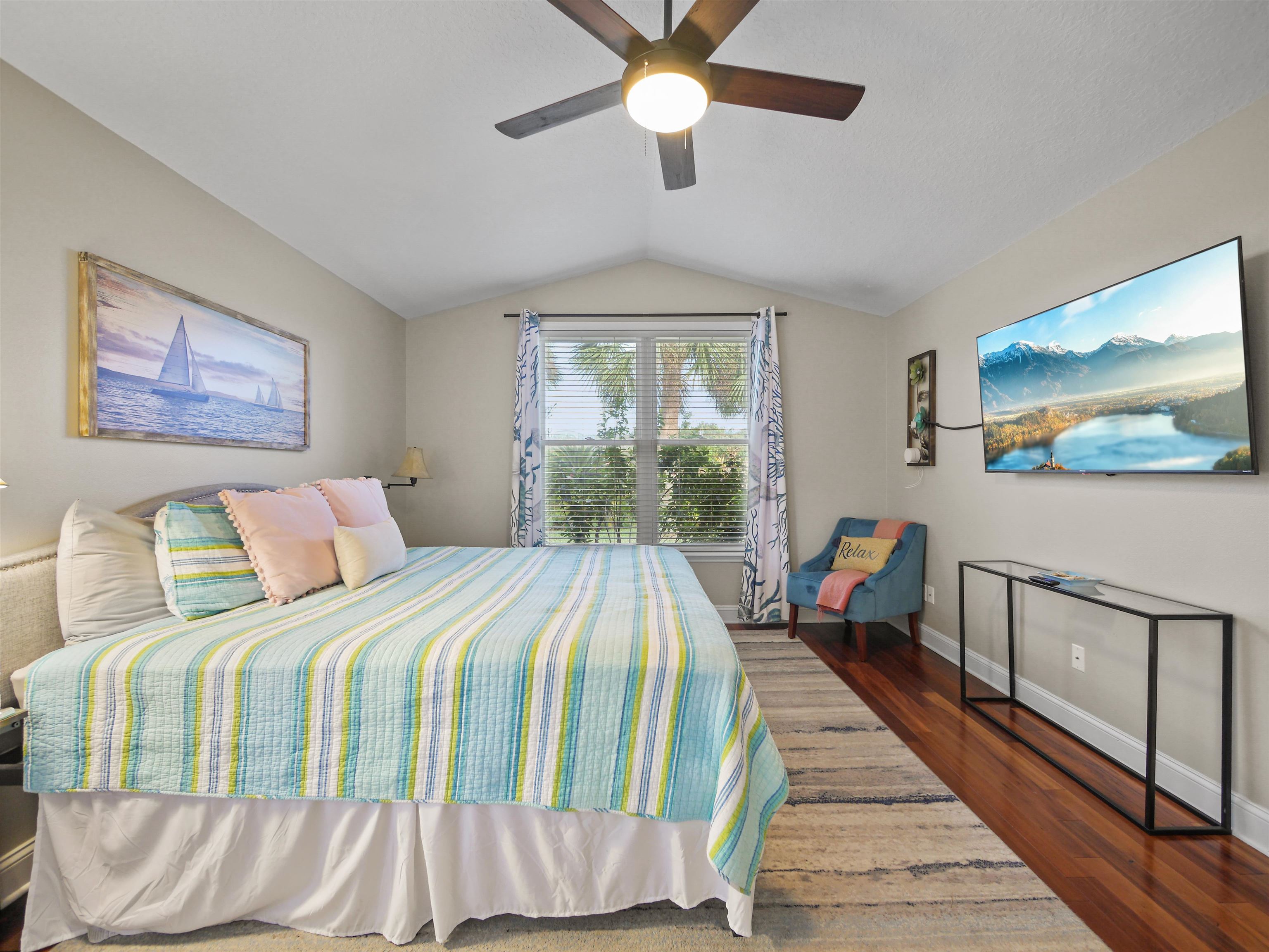 5301 1st Street St. Augustine, FL 32080 - Photo 15 of 36 a bed sitting in a bedroom next to a window