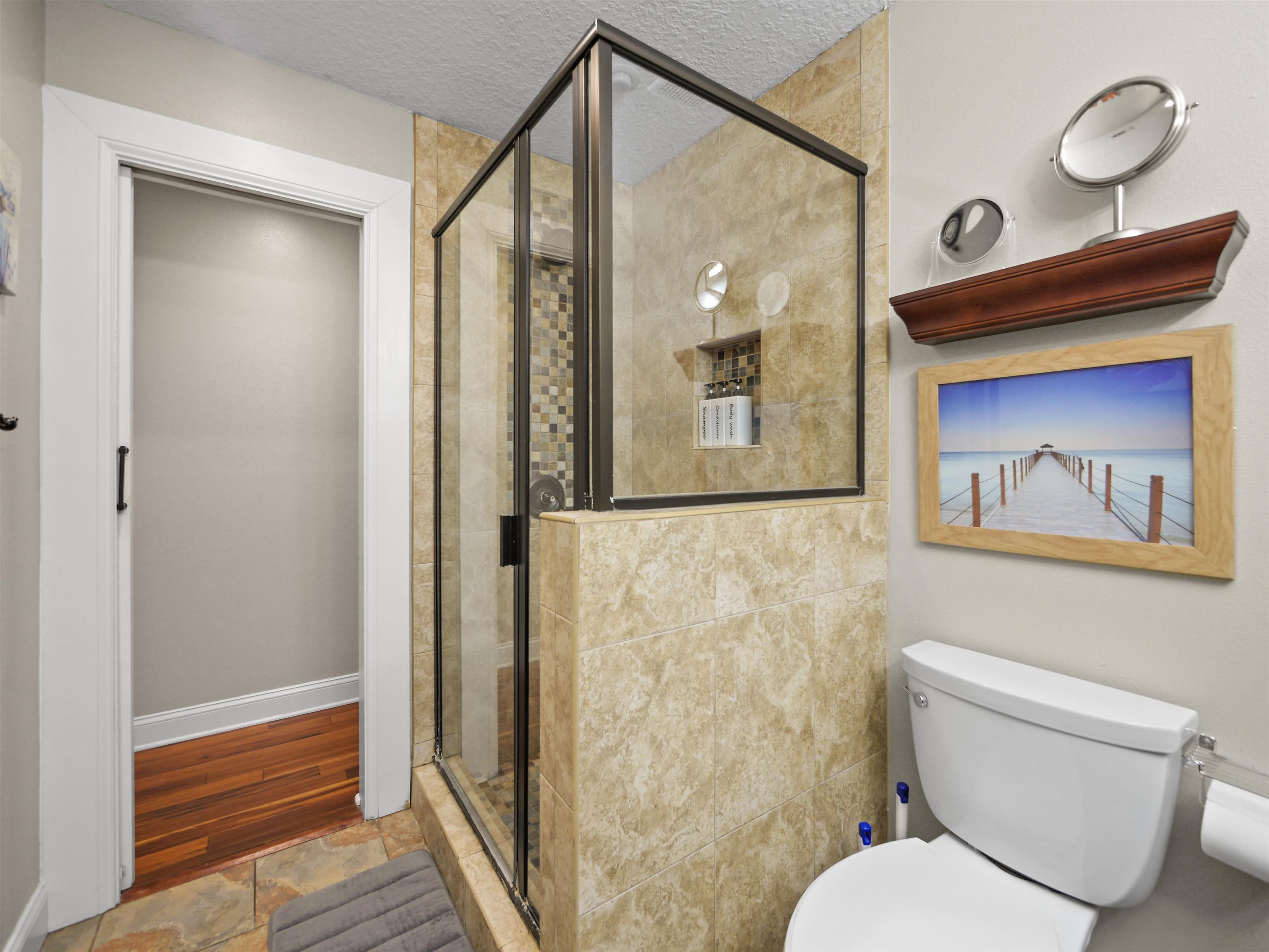 5301 1st Street St. Augustine, FL 32080 - Photo 22 of 36 a bathroom with a toilet sink and shower