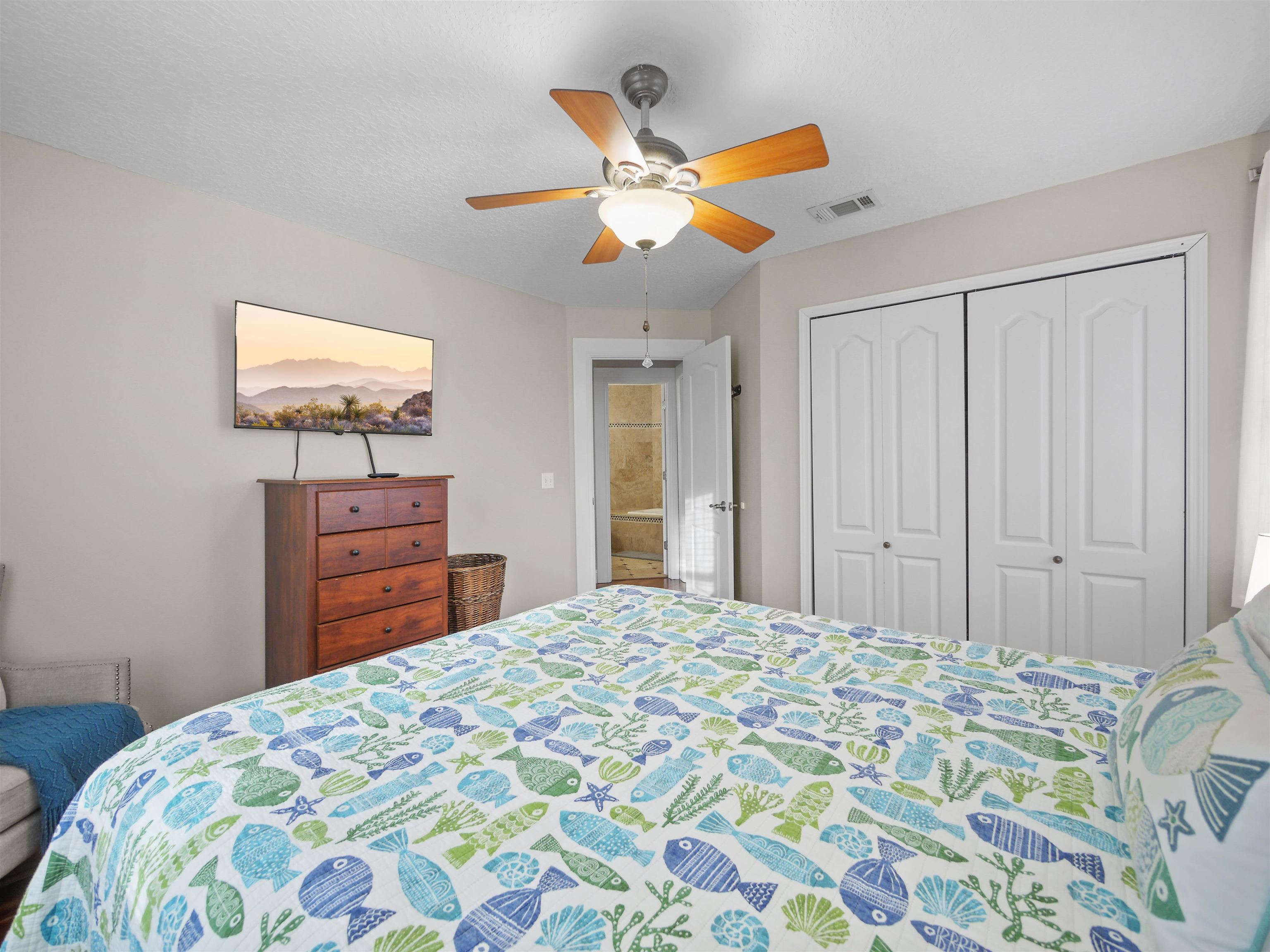 5301 1st Street St. Augustine, FL 32080 - Photo 24 of 36 a bedroom with a bed and a television