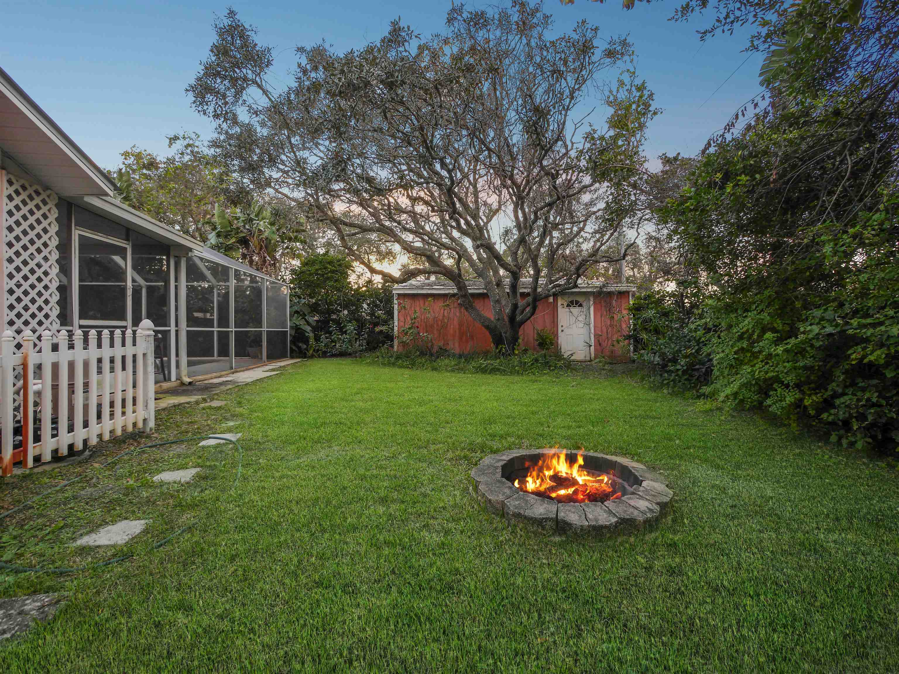 5301 1st Street St. Augustine, FL 32080 - Photo 29 of 36 a view of a backyard with a garden and entertaining space