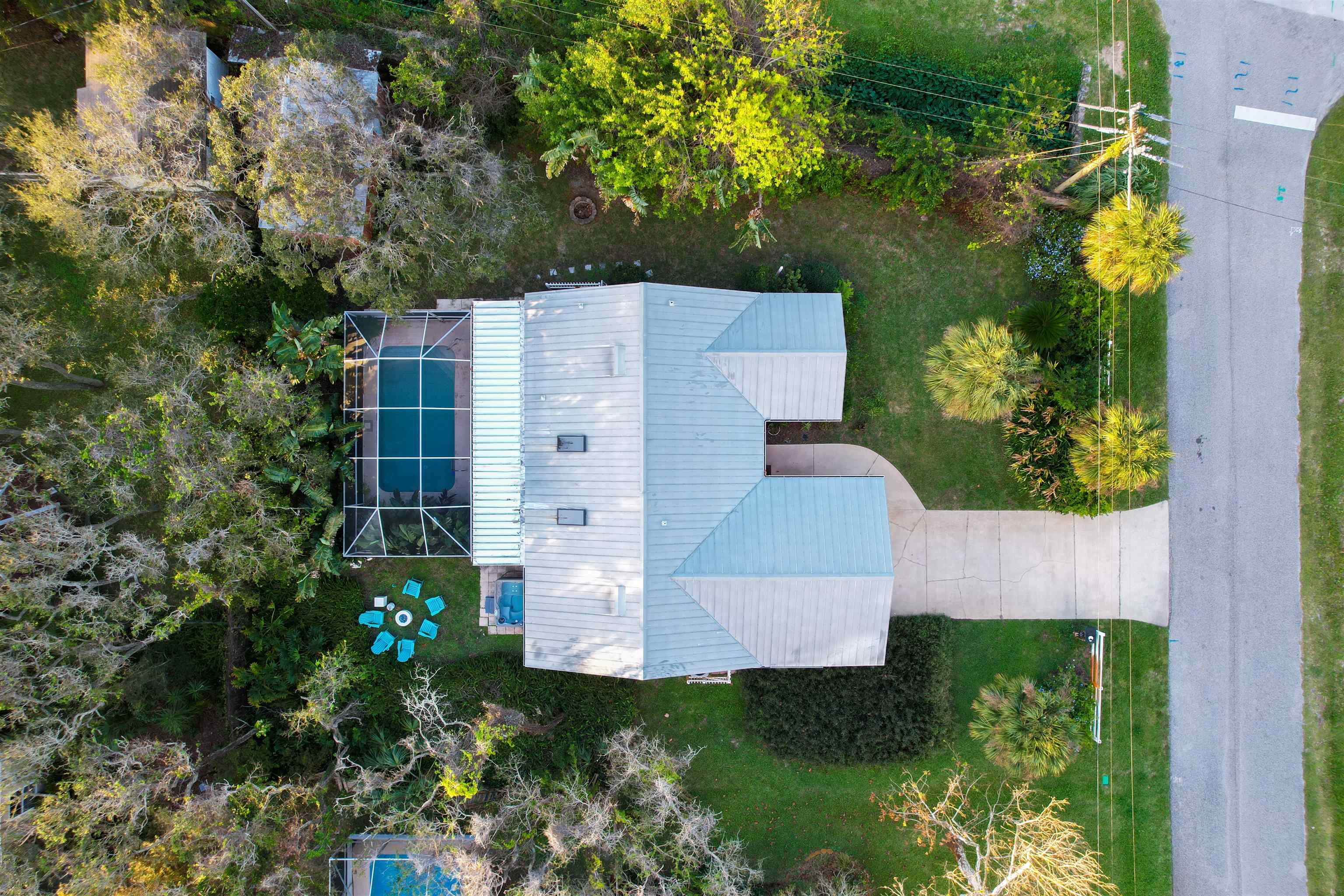 5301 1st Street St. Augustine, FL 32080 - Photo 33 of 36 an aerial view of a house with a yard and garden