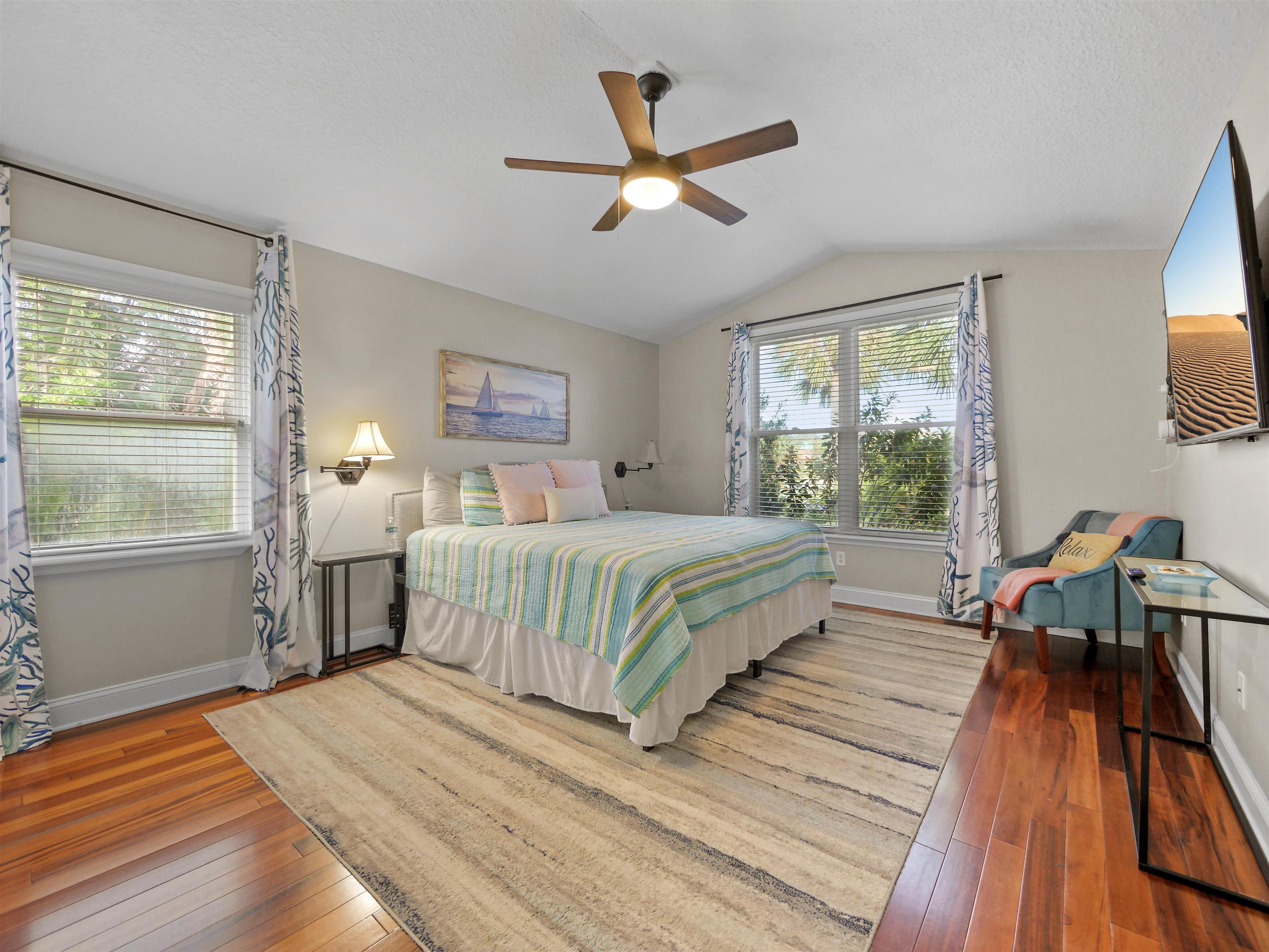 5301 1st Street St. Augustine, FL 32080 - Photo 5 of 36 a bedroom with a bed wooden floor and a window