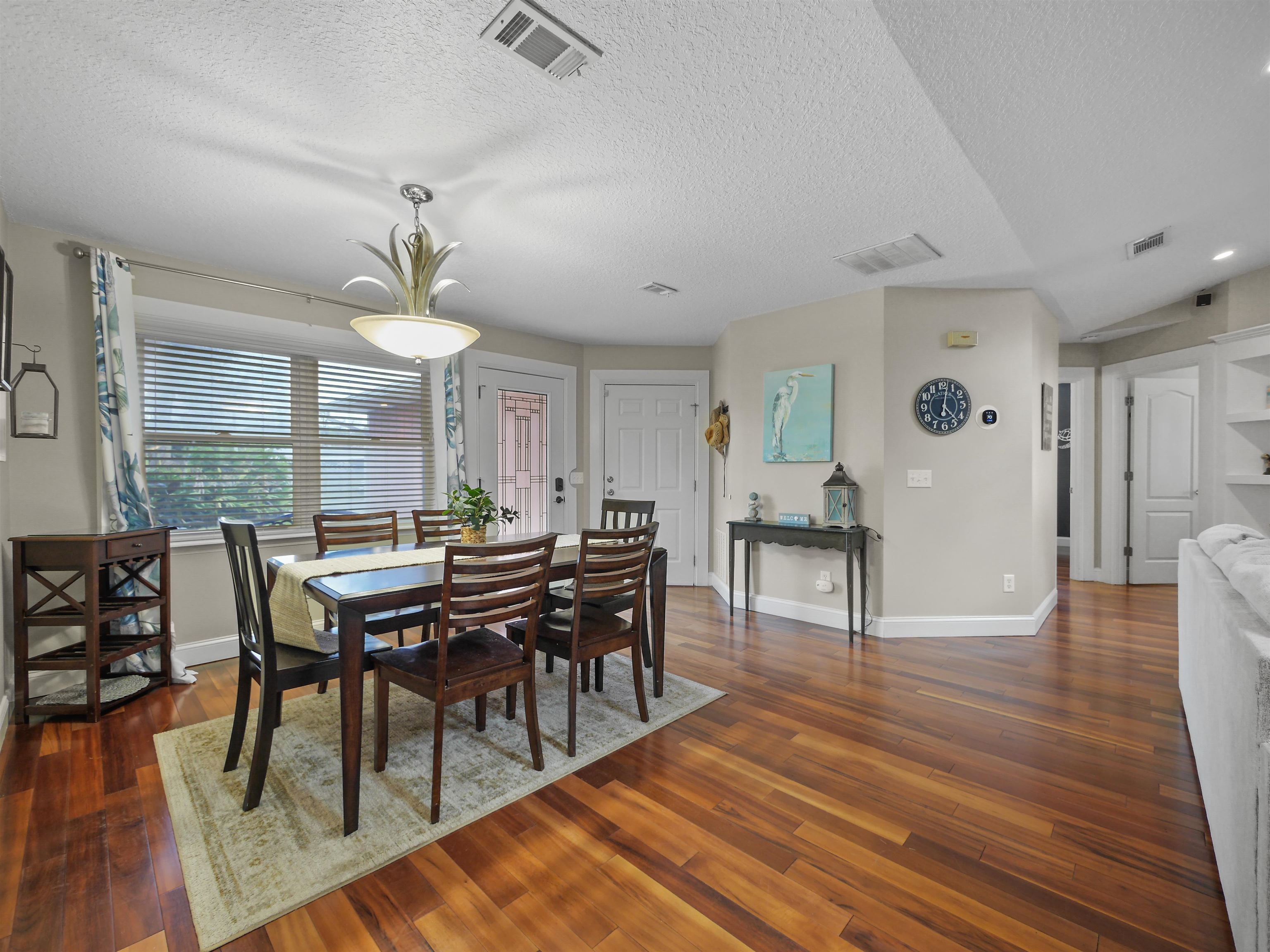 5301 1st Street St. Augustine, FL 32080 - Photo 8 of 36 a view of a dining room with furniture and wooden floor